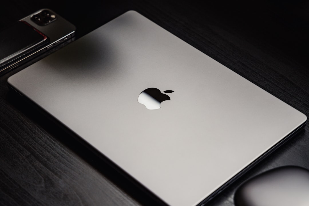 macbook refurbished - a black cell phone